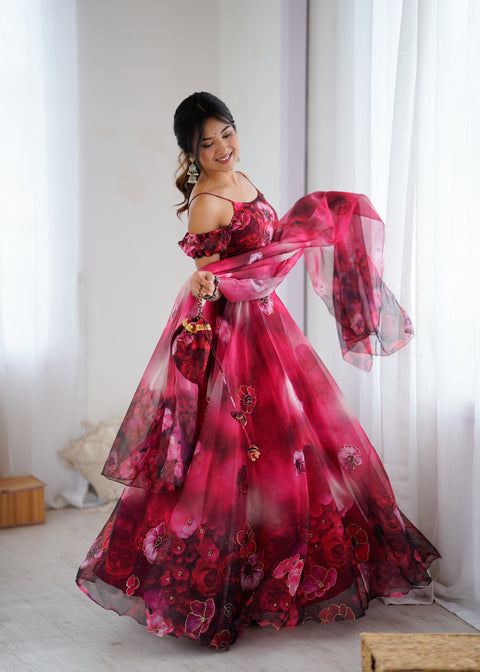 Woman wearing a red floral dress in a room with white curtains.